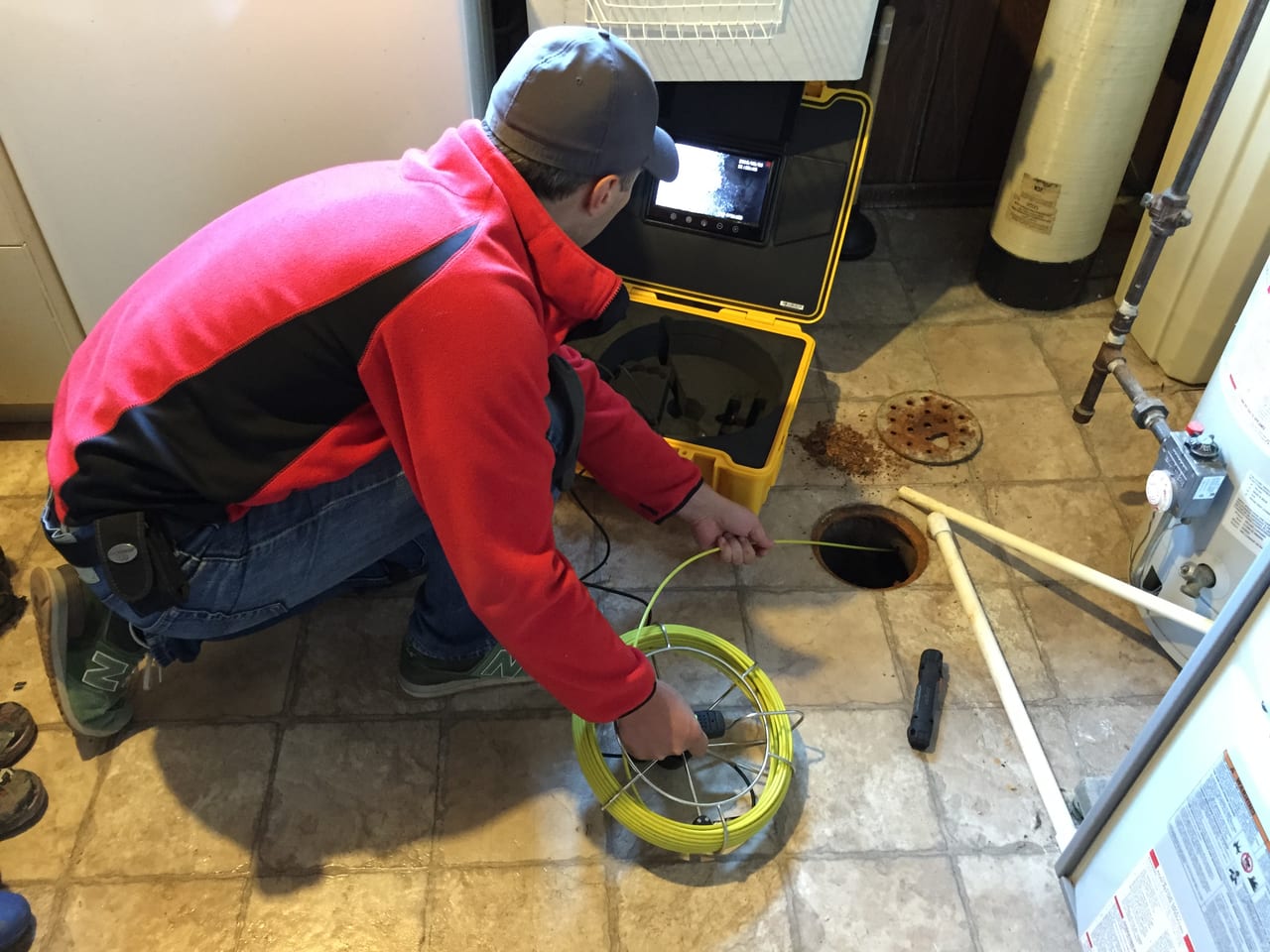 Drain inspection camera and cable at an access point